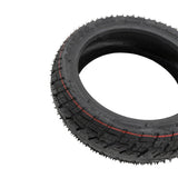 Pneu tubeless 9,5x2,50 pose a plat montrant la section et la hauteur