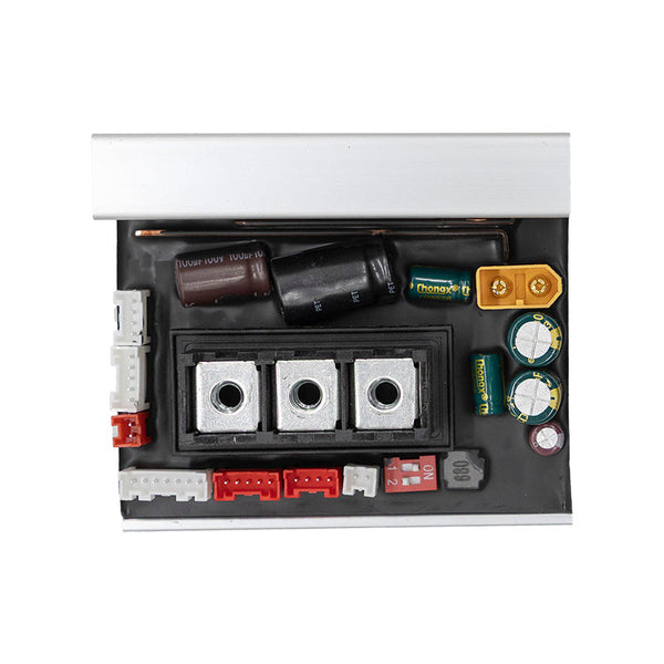 Vue dessus PCB contrôleur — 3 bornes phases moteur, DIP switch 1-2 ON, composants électroniques