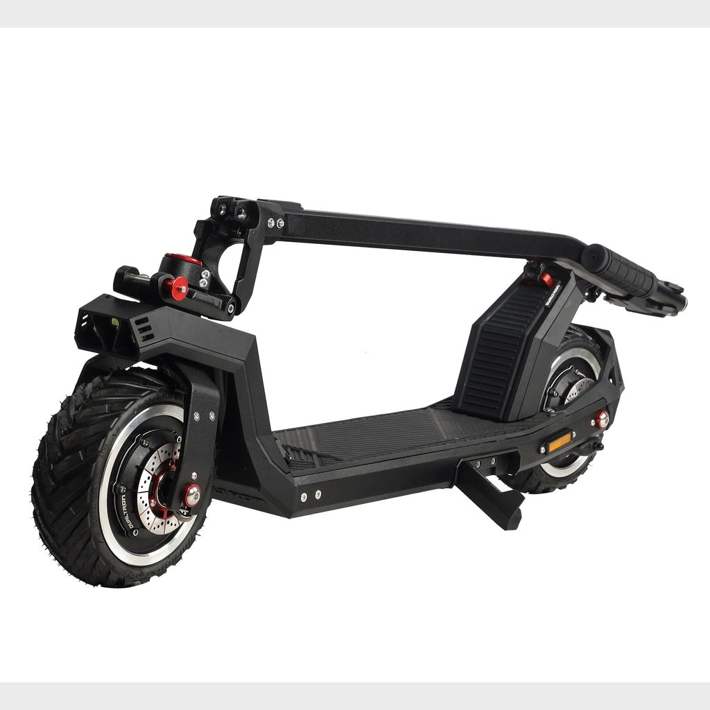 Dualtron Sonic Pro pliée au sol — détail freins à disque et pneus
